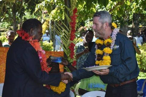 Peter Lynch (right) officially handling the keys for Talise Hydro Stage 2 to Vanuatu’s Minister of Planning and Climate Change Adaptation, Ham Lini.